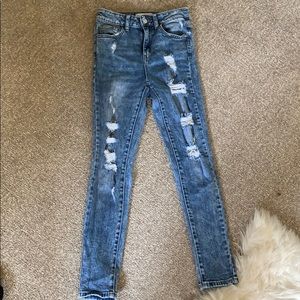 jeans, high wasted, and distressed.